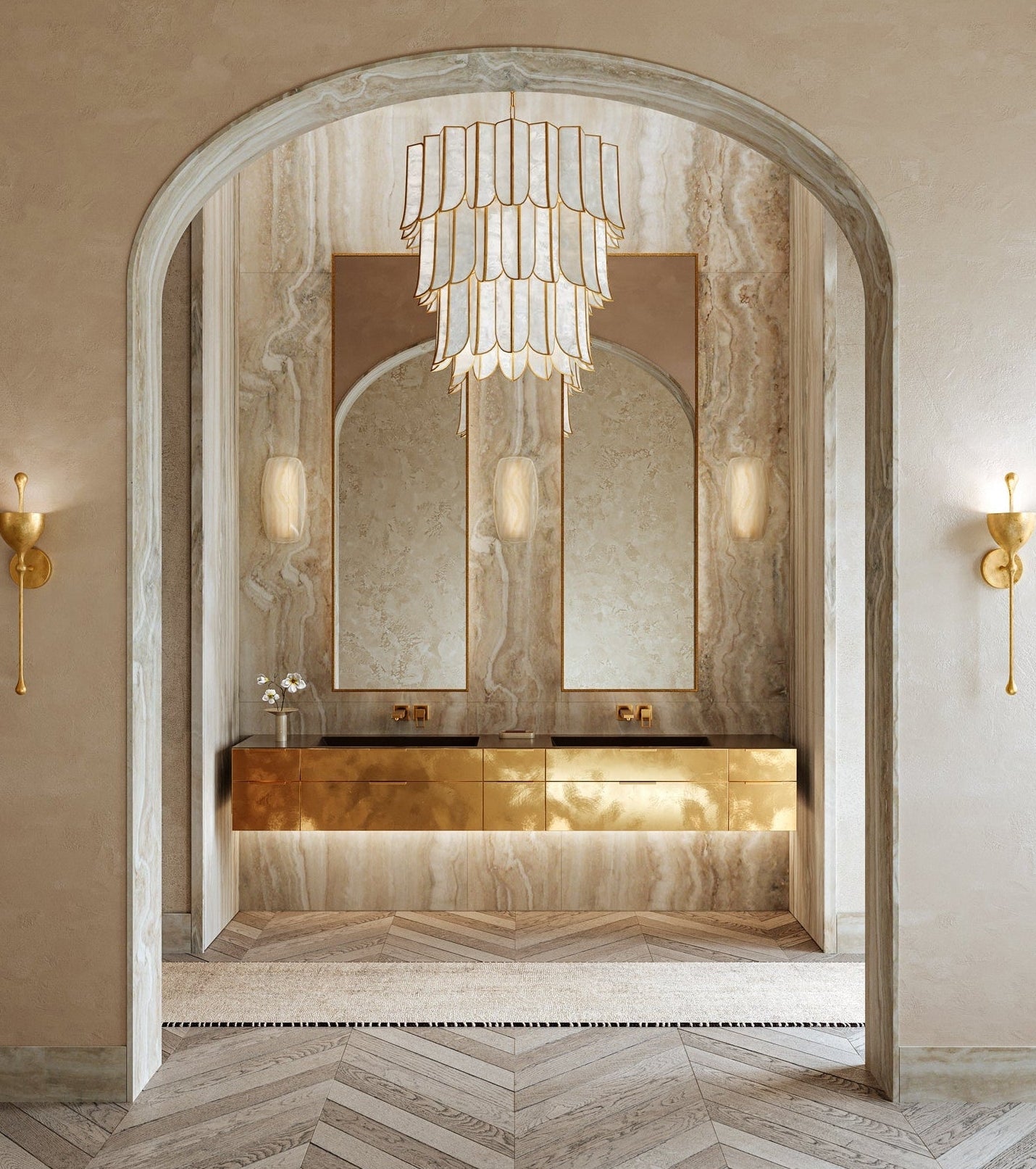 Luxurious bathroom with a large mirror, chandelier, and wall sconces.