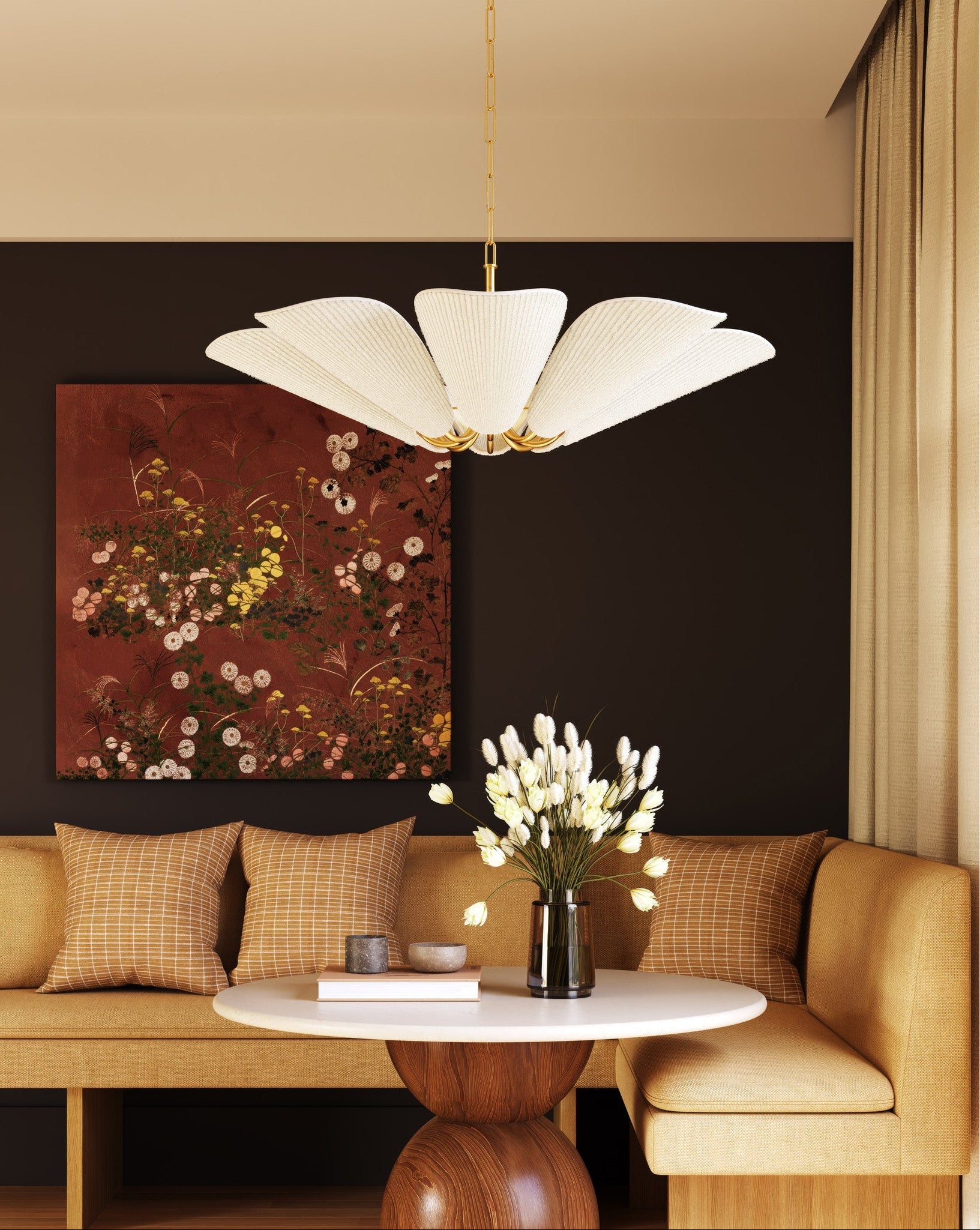 Modern living room with a chandelier, sofa, and decorative elements.